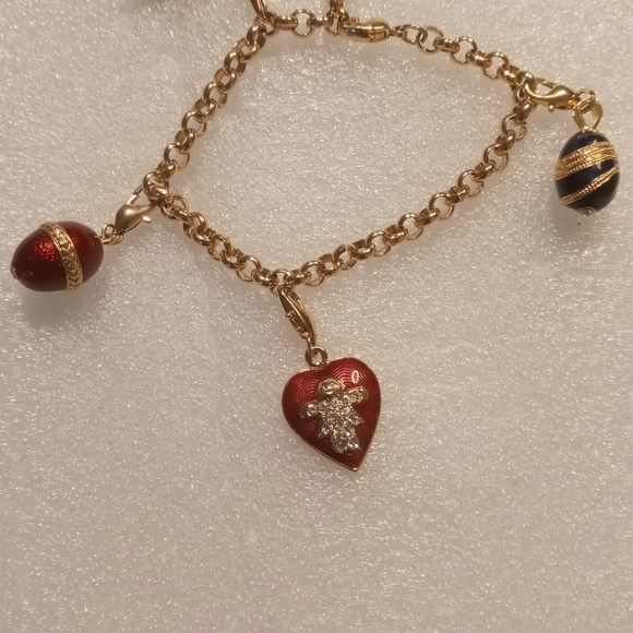 Faberge egg charm bracelet on a gold tone rolo chain. - Picture 16 of 16